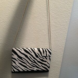 Zebra print shoulder strap/clutch purse.